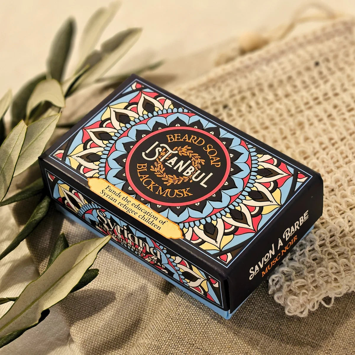Black Musk Aleppo soap box close-up with olive leaves