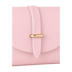 Close-up detail of gold metal loop closure on the front flap