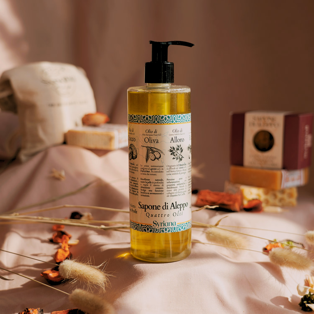 Syriana Quattro Olii Liquid Aleppo Soap 400ml - bottle with pump standing next to soap bars and rustic packaging